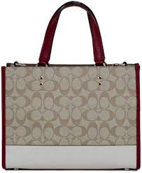 Bolso COACH Dempsey con Jacquard y Parche a Rayas